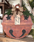 Rustic jingle bell Merry Christmas door hanger with burlap bow and pinecone, cut by Rise and Shine Gifts in Dothan, Alabama SHINE-DH-015