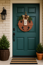 Rustic jingle bell Christmas door hanger on a front door entryway, cut by Rise and Shine Gifts in Dothan, Alabama SHINE-DH-015