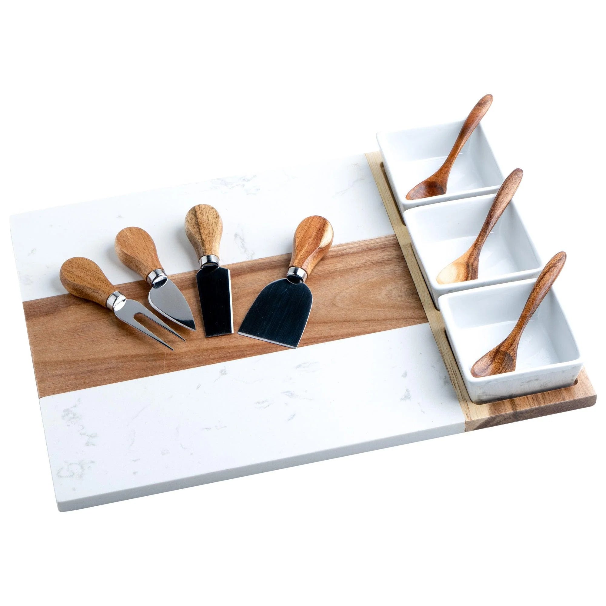 A charcuterie board made of acacia wood and marble, accompanied by an assortment of cheese knives and spoons with wooden handles, set against a white background.