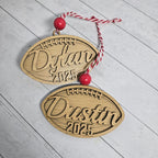 Two personalized football name and year layered wood Christmas ornaments with red beads, cut by Rise and Shine Gifts in Dothan, Alabama OR-034