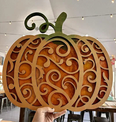 Copper-orange epoxy scroll pumpkin door hanger with 3D laser-cut scroll layer, epoxy workshop by Rise and Shine Gifts in Dothan, Alabama SHINE-WS-002